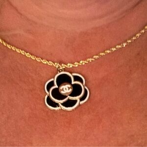 CHANEL Black and Gold Floral Pendant Necklace